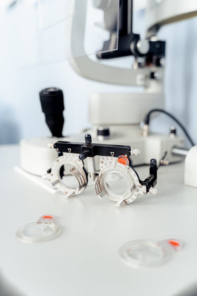 Close-up of trial frames and lenses in a sleek, modern optometry clinic.